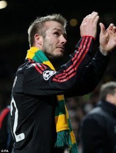 Beckham demonstrated his support for the MUFC Supporters Trust as he wore the gold and green scarf